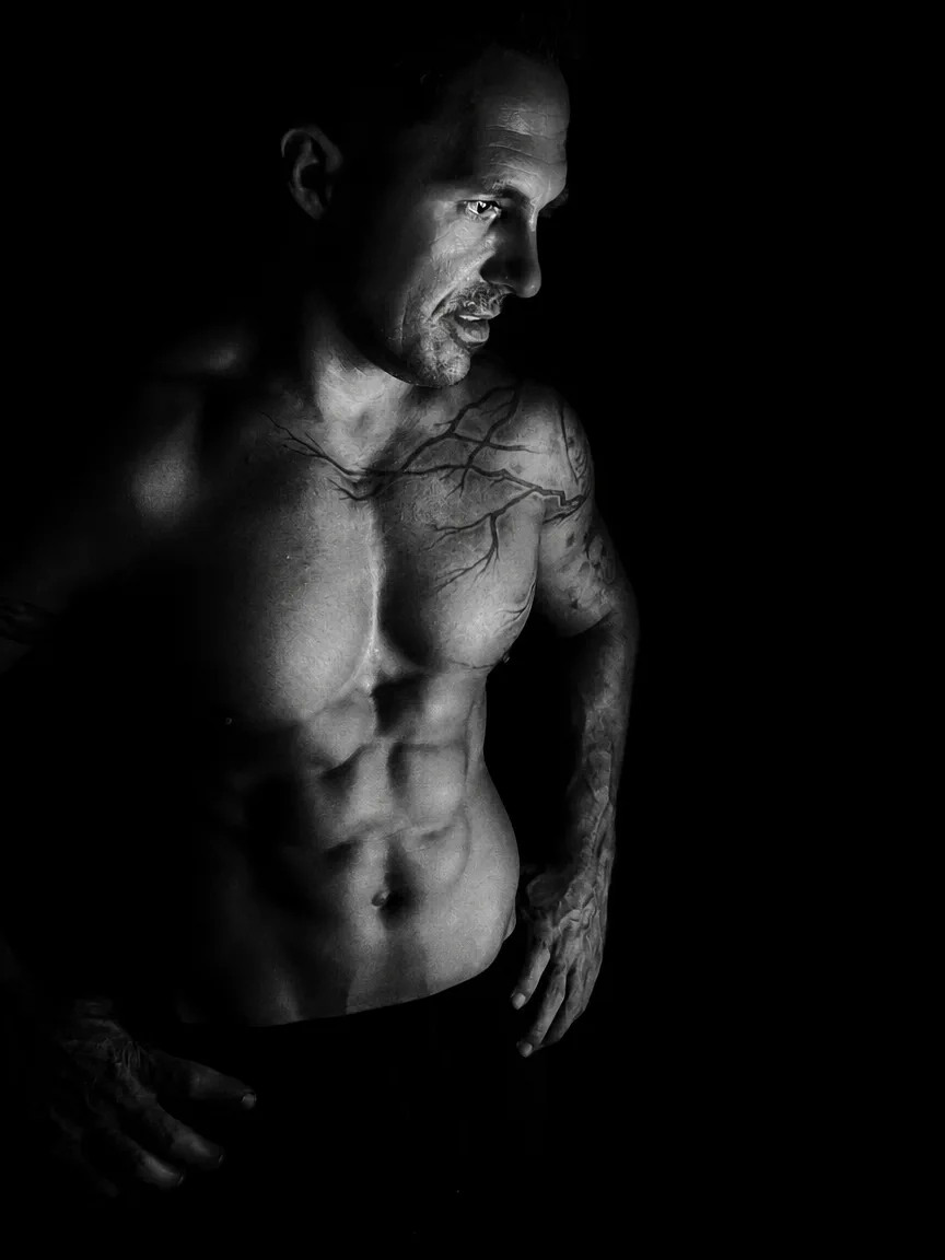 Powerlifting coach Istvan Repas in a low-key black and white portrait