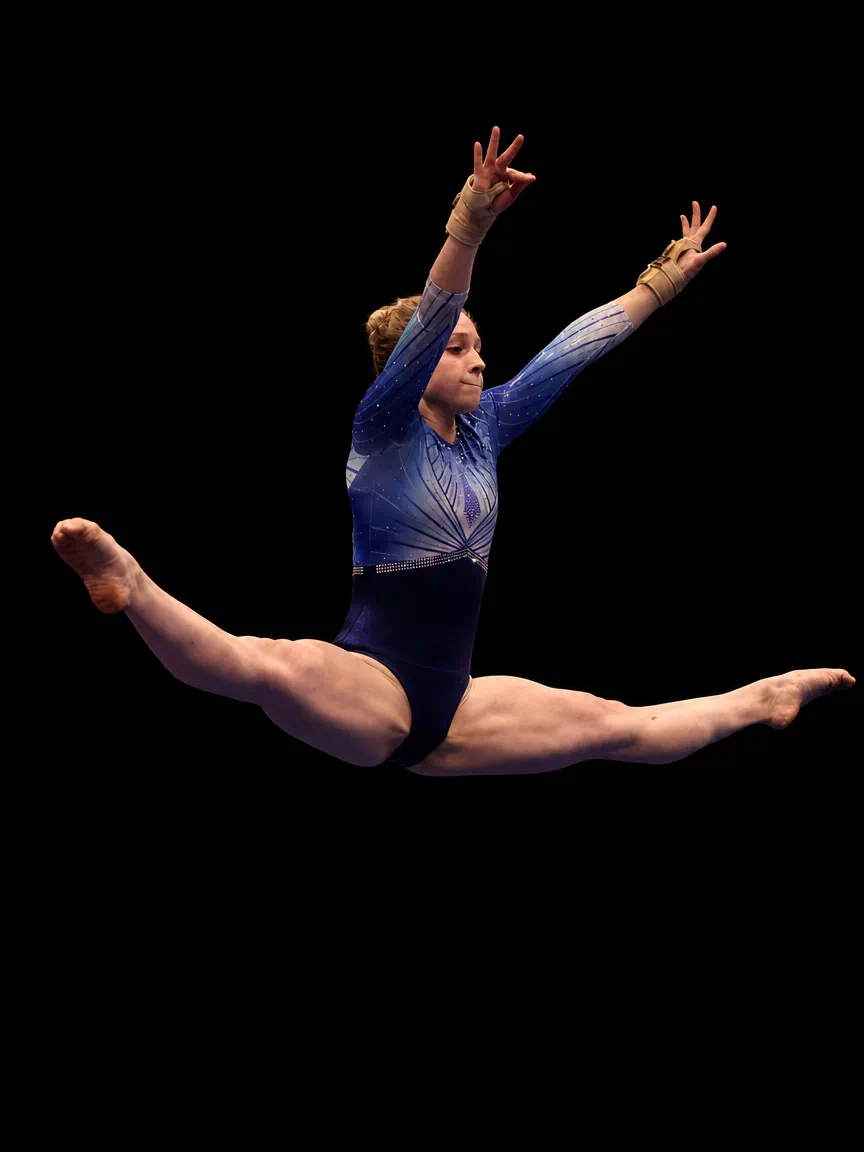 Gymnast Helena Stewart mid-air in a full split leap